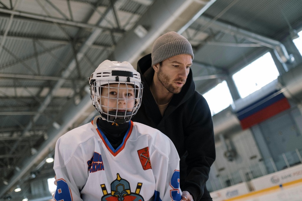 Coach Thrive et enfant sur la glace